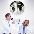 Composite image of businessman yelling with a megaphone at his colleague Royalty Free Stock Photo