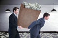 Composite image of businessmen carrying bag of dollars