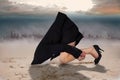 Composite image of businesswoman burying her head