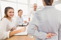 Composite image of businesswoman with fingers crossed behind her back over white background Royalty Free Stock Photo