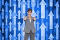 Composite image of businesswoman giving thumbs up Royalty Free Stock Photo