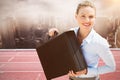 Composite image of businesswoman holding briefcase Royalty Free Stock Photo