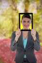 Composite image of businesswoman holding digital tablet Royalty Free Stock Photo