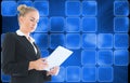 Composite image of businesswoman holding tablet Royalty Free Stock Photo