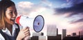 Composite image of businesswoman shooting through a megaphone