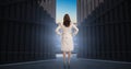 Composite image of businesswoman standing back to camera 3d Royalty Free Stock Photo