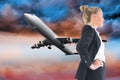 Composite image of businesswoman standing with hands on hips Royalty Free Stock Photo