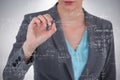 Composite image of businesswoman using invisible digital screen Royalty Free Stock Photo