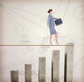 Composite image of businesswoman walking tightrope Royalty Free Stock Photo