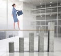 Composite image of businesswoman walking tightrope Royalty Free Stock Photo