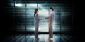 Composite image of businesswomen shaking hands Royalty Free Stock Photo