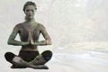 Composite image of calm blonde sitting in lotus pose with hands together Royalty Free Stock Photo