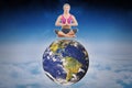 Composite image of calm blonde sitting in lotus pose with hands together Royalty Free Stock Photo