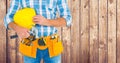 Composite image of Carpenter with hammer against wood panel Royalty Free Stock Photo