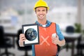 Composite image of carpenter holding digital tablet and mobile phone Royalty Free Stock Photo