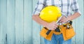 Composite image of Carpenter torso with hammer against blue wood panel Royalty Free Stock Photo