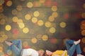 Composite image of casual couple lying on floor Royalty Free Stock Photo