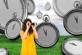 Composite image of casual young woman using binoculars Royalty Free Stock Photo