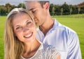 Composite image of caucasian couple embracing each other against golf course with copy space Royalty Free Stock Photo