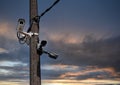 Composite image of cctv cameras. Cam on the pole, cloudy sky