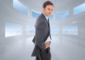 Composite image of cheerful businessman standing with hands on hips Royalty Free Stock Photo