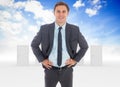 Composite image of cheerful businessman standing with hands on hips Royalty Free Stock Photo