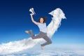 Composite image of cheerful classy businesswoman jumping while holding megaphone Royalty Free Stock Photo
