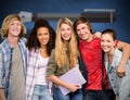 Composite image of cheerful college students in library