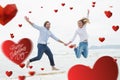 Composite image of cheerful couple holding hands and jumping at beach Royalty Free Stock Photo