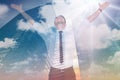 Composite image of cheering businessman with his arms raised up Royalty Free Stock Photo