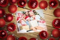 Composite image of christmas baubles on table Royalty Free Stock Photo