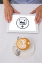 Composite image of close-up of digital tablet and coffee on table Royalty Free Stock Photo
