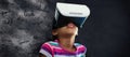 Composite image of close up of girl using virtual reality simulator Royalty Free Stock Photo