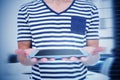 Composite image of close up of man holding tablet Royalty Free Stock Photo