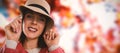 Composite image of close-up portrait of young woman in hat Royalty Free Stock Photo