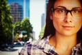 Composite image of close up portrait of young woman wearing eyeglasses Royalty Free Stock Photo