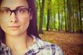 Composite image of close up portrait of young woman wearing eyeglasses Royalty Free Stock Photo