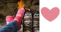 Composite image of close up of romantic legs in socks in front of fireplace