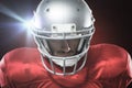 Composite image of close-up of serious american football player in red jersey looking down Royalty Free Stock Photo