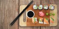 Composite image of close up of sushi served on cutting board Royalty Free Stock Photo