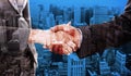 Composite image of close up of two businesspeople shaking their hands Royalty Free Stock Photo