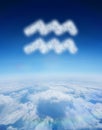 Composite image of cloud in shape of aquarius star sign