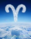 Composite image of cloud in shape of aries star sign