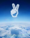 Composite image of cloud in shape of hand making peace sign Royalty Free Stock Photo