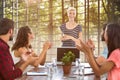 Composite image of colleagues clapping hands in a meeting