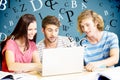 Composite image of college students using laptop in library Royalty Free Stock Photo