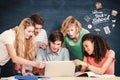 Composite image of college students using laptop in library Royalty Free Stock Photo