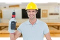 Composite image of confident carpenter holding cordless drill machine Royalty Free Stock Photo