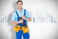 Composite image of confident carpenter holding drill machine Royalty Free Stock Photo