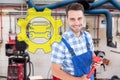 Composite image of confident young male repairman holding monkey wrench Royalty Free Stock Photo